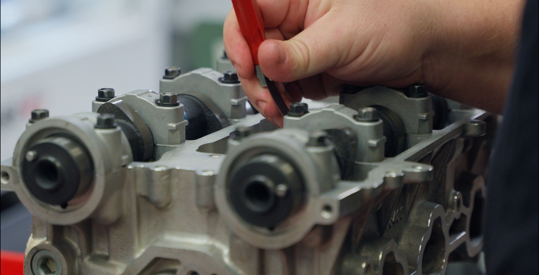 Camshaft being work on in cylinder head